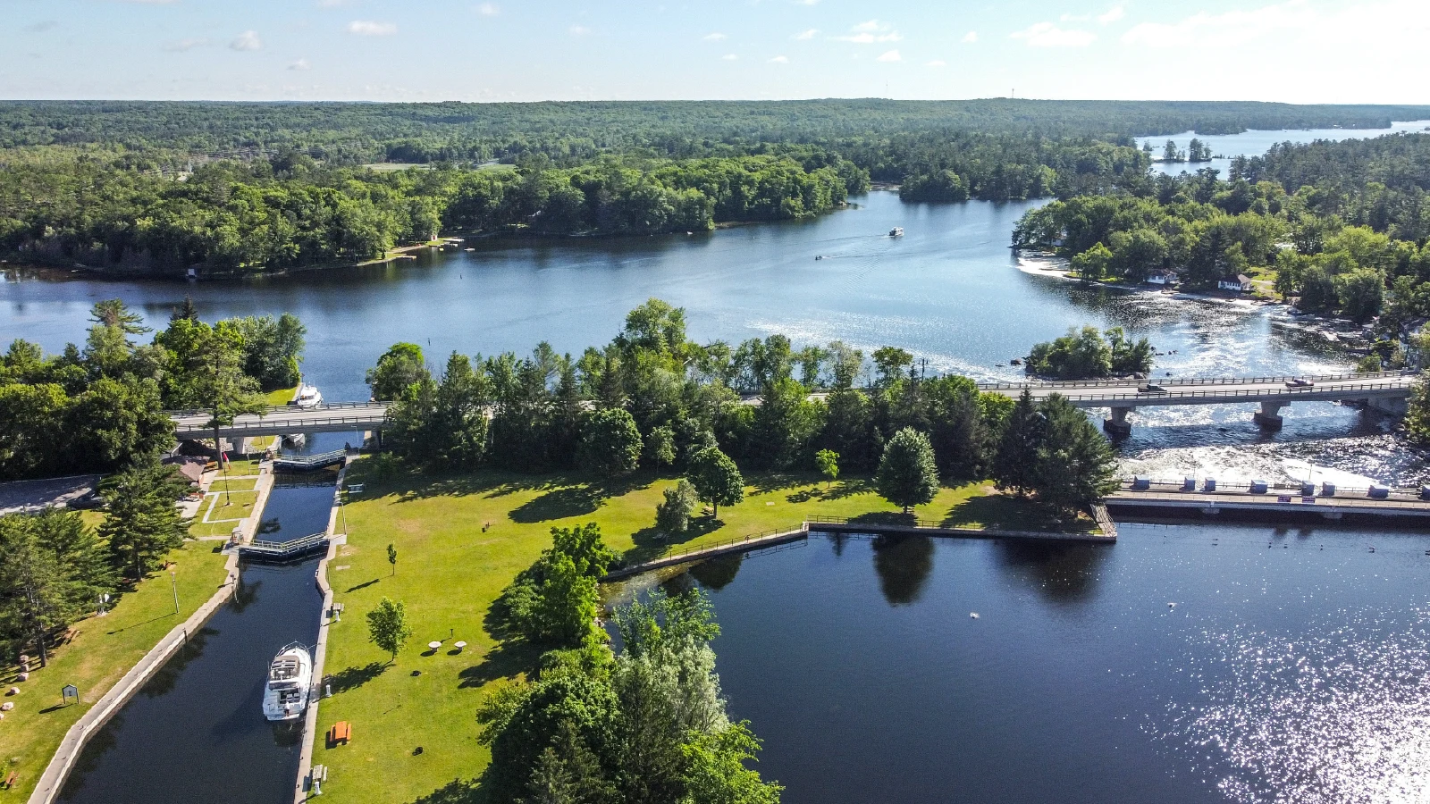 Aerial view of Buckhorn Lock 31 on the Trent-Severn Waterway with boats, bridge, and waterfront in Kawartha Lakes Ontario